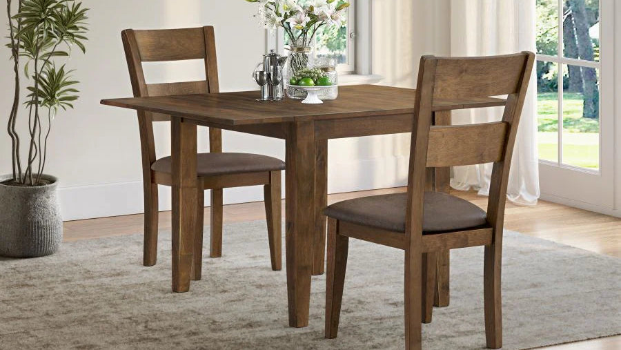 Wooden dining table with chairs in a room with a plant and window.