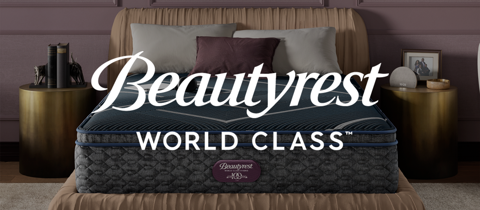 Beautyrest World Class mattress on a bed with decorative pillows and side tables and Beautyrest World Class logo on top
