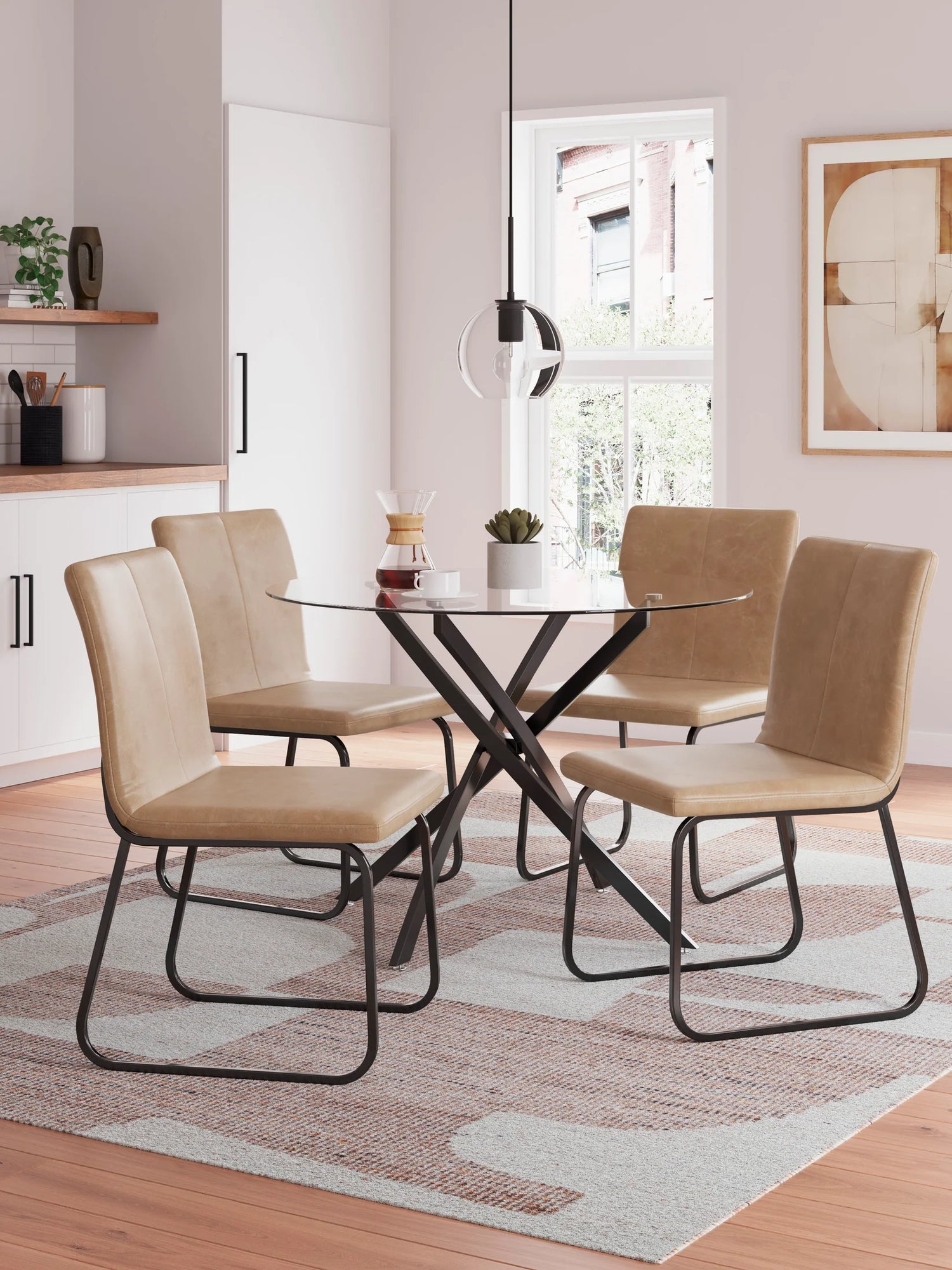 Dining room with a glass table and beige chairs on a patterned rug.