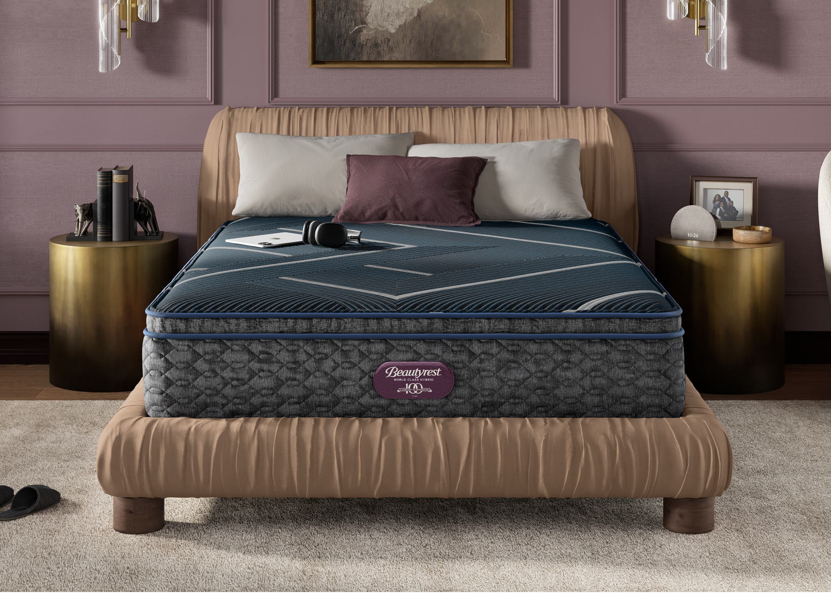 Hybrid plush pillowtop mattress on a bed in a bedroom setting with decorative elements.