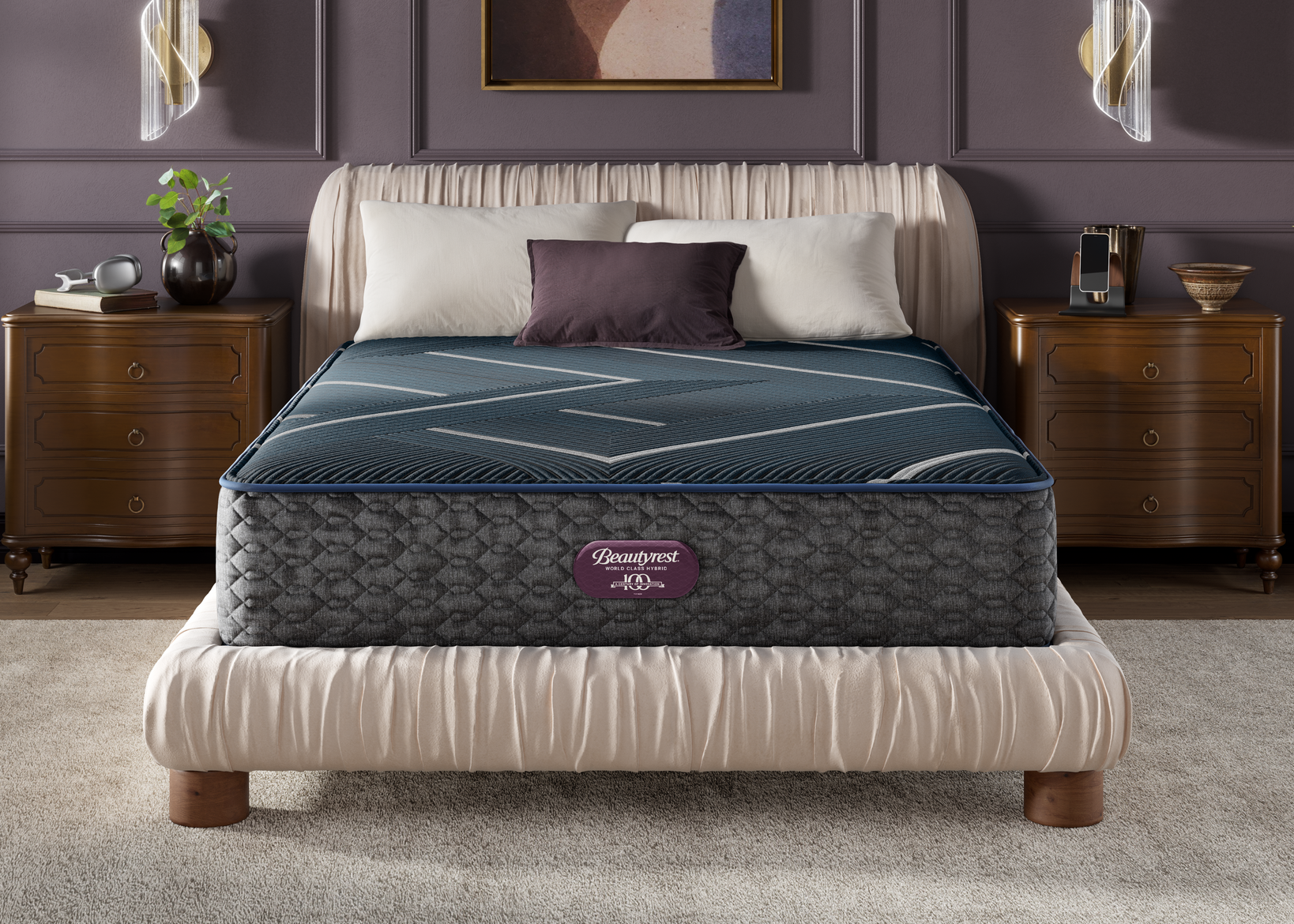 Hybrid plush mattress on a bed in a bedroom setting with decorative elements.